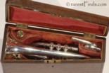 Walnut case with antique, 1868 Isaac Fiske Cornet