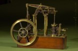  model of a four column rotative James Watt vertical steam engine of the reciprocating beam type with double-action low-pressure single-cylinder, Watt's “parallel motion” linkage, and Watt's centrifugal speed governor